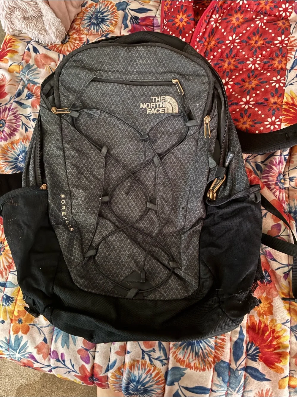 The North Face Backpack in Charcoal Gray and Black with rose gold accents